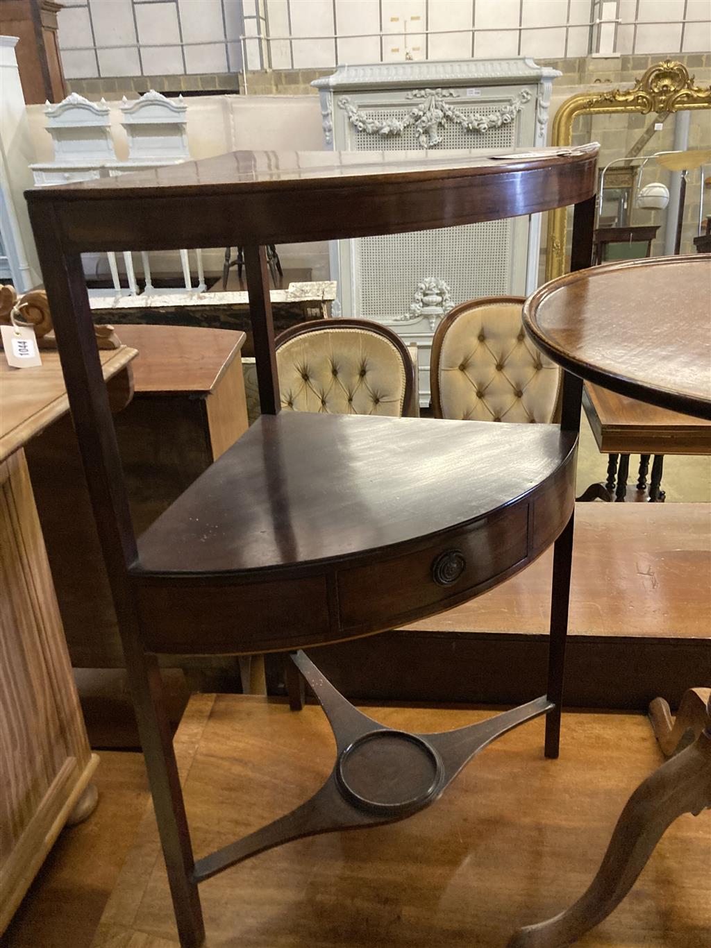 A George III mahogany corner washstand, width 58cm, depth 40cm, height 83cm together with a circular mahogany tripod wine table, diamet
